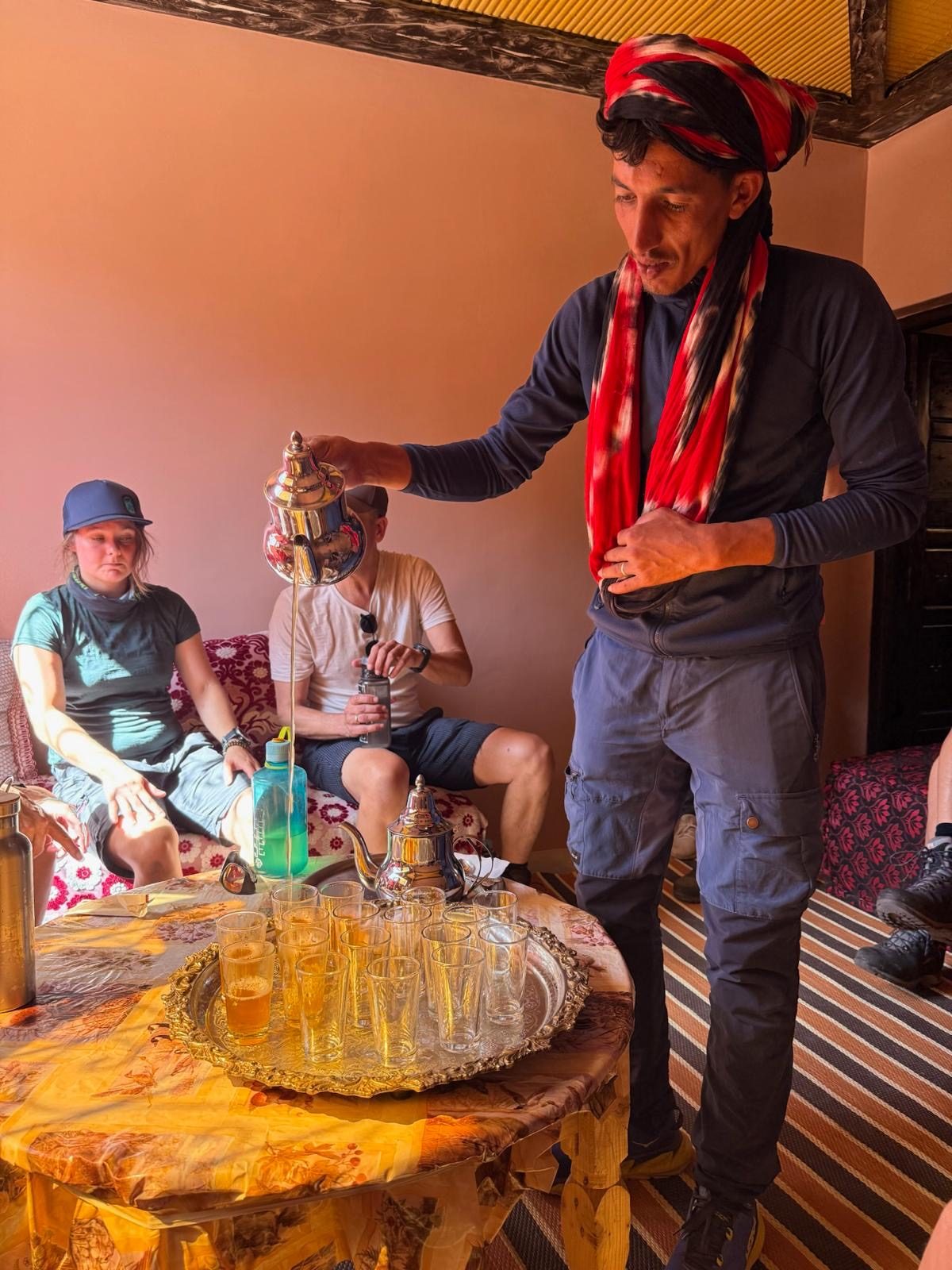 Rdouane pouring mint tea for guests